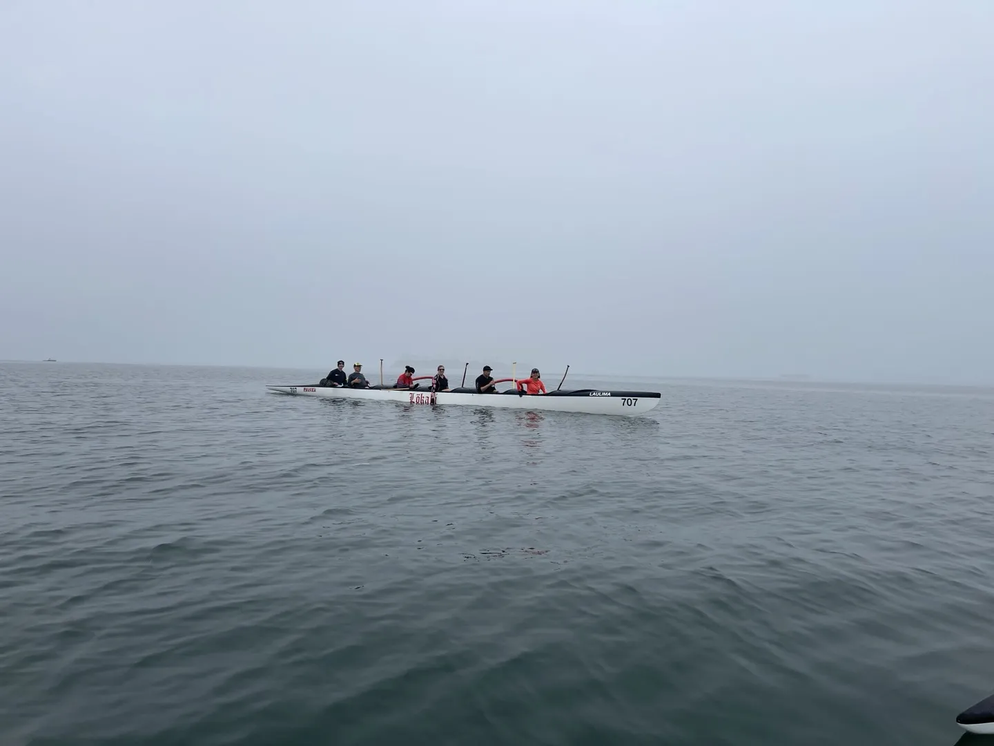 Lokahi crew paddling in foggy waters